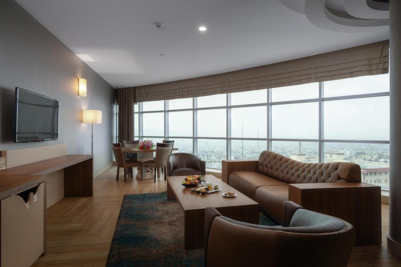 Titanic Hotel & Spa Sulaymaniyah Exterior photo A living room in a suite at the hotel