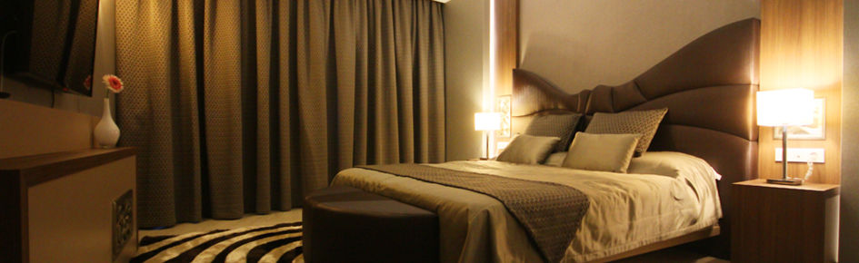 Titanic Hotel & Spa Sulaymaniyah Exterior photo A bedroom with curtains